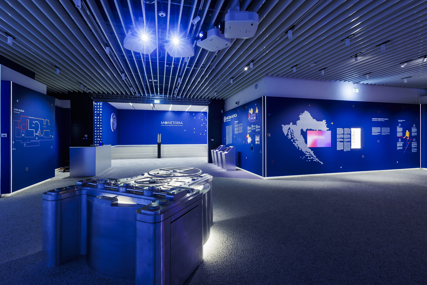Moneterra, Moneterra muzej, Muzej novca, Muzej novca HNB, Hrvatska narodna banka, HNB, muzej financija, financijska pismenost, edukacija o novcu, međunarodna nagrada, International Property Awards, nagrada za dizajn interijera, Best Public Service Interior, Ante Vrban, arhitekt Ante Vrban, hrvatski arhitekt, nagrađeni projekt, arhitektura, dizajn interijera, javni prostor, Ban centar Zagreb, Zagreb muzej, hrvatski dizajn, hrvatska arhitektura, Real grupa, Krešimir Renzo Prosoli, Studio Rašić & Vrabec, MA 18plus, Hust, Novena, Kamgrad, Promondis, Accessus, suvremeni muzej, interaktivni muzej, edukativni centar, multimedijalni sadržaji, povijest novca, tehnologija u muzeju, bankarstvo, monetarna politika, centralna banka, financijska edukacija, hrvatski projekt, inovativni dizajn, kreativnost, arhitektonski projekt, dizajnerski projekt, svjetsko priznanje, arhitektonska nagrada, međunarodno priznanje, hrvatska stručnost, hrvatska kreativnost, dizajn javnog prostora, muzej u Zagrebu, najbolji interijer, svjetski dizajn, nagrađeni arhitekt, kulturna atrakcija, financijski muzej, edukativni sadržaj, interaktivno iskustvo, hrvatski uspjeh, hrvatski brend, muzej budućnosti, moderni muzej, arhitektura u Zagrebu, interijer nagrađen, kulturna institucija, suvremeni interijer, dizajn nagrada, edukacija građana, osobne financije, uloga banaka, edukacija o financijama, tehnološki napredan muzej, dizajn nagrađen u Londonu, London nagrada, hrvatski projekt u Londonu, međunarodni uspjeh, hrvatski inovatori, kulturna baština, hrvatska kultura, financijska kultura, HNB muzej, muzej besplatan ulaz, muzej u centru Zagreba, Zagreb atrakcija, što posjetiti u Zagrebu, besplatni muzej, hrvatski arhitekti, muzejski projekt, edukacija mladih, financijska svijest, financijska edukacija djece, moderni dizajn interijera, interaktivni sadržaji, multimedijalna instalacija, arhitektonska izvrsnost, dizajnerska izvrsnost, nagrada Europa Afrika, hrvatska arhitektura u svijetu, hrvatska nagrada za dizajn, arhitektura 2025, Moneterra Zagreb.